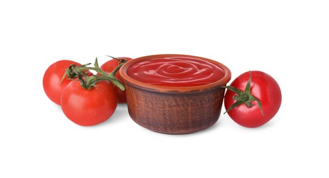 Photo of Bowl with tasty ketchup and fresh tomatoes isolated on white