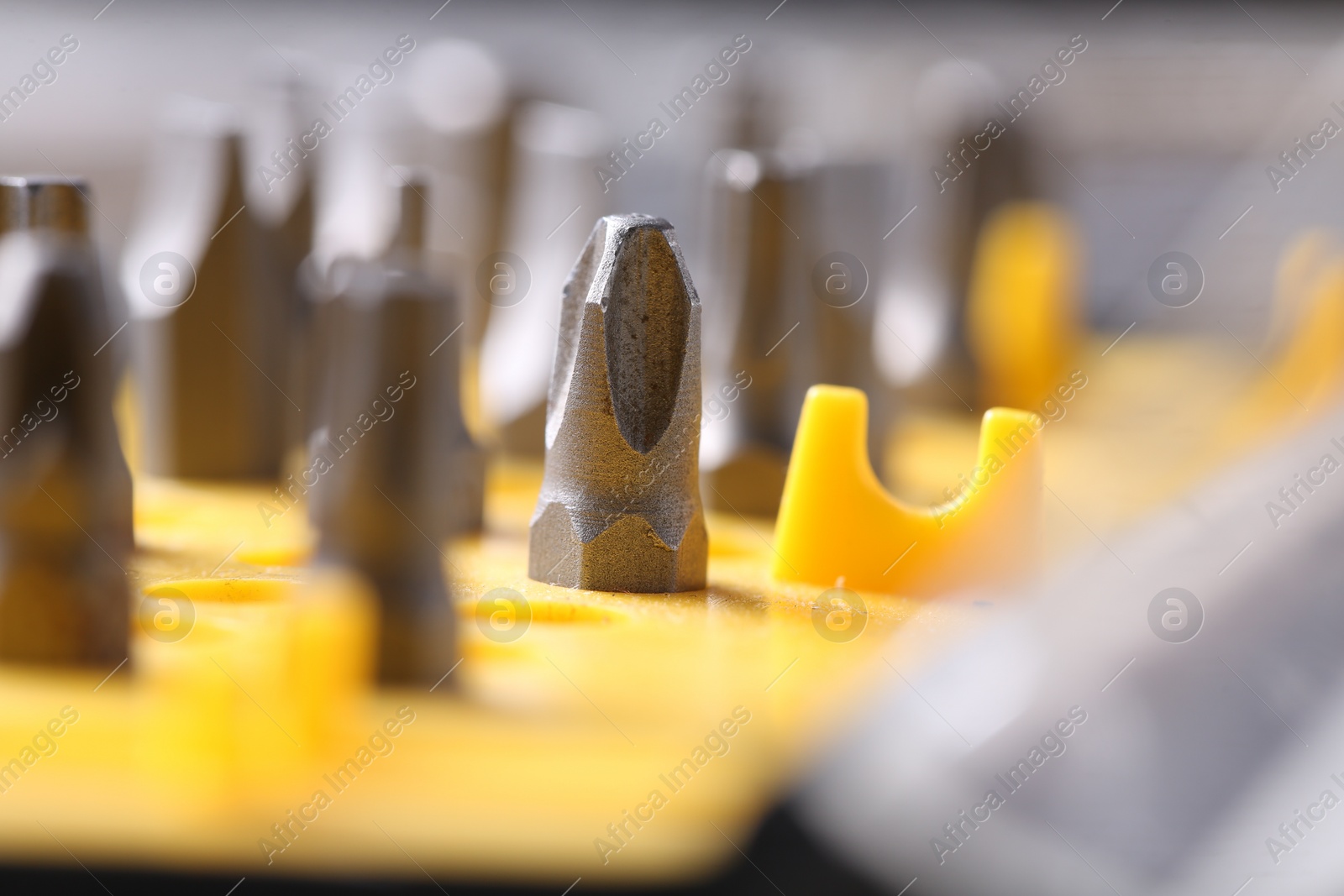 Photo of Screwdriver bit set on blurred background, closeup