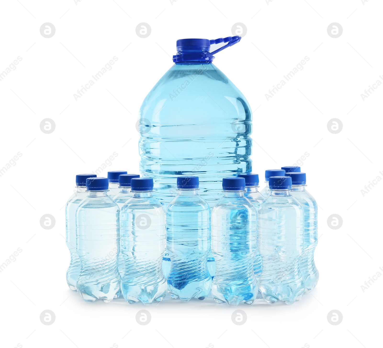 Photo of Large and small bottles of water on white background