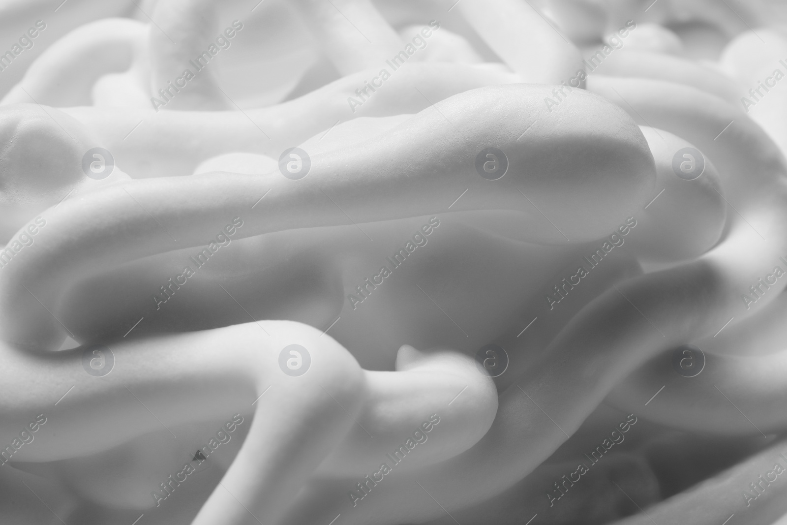 Photo of Texture of white shaving foam as background, closeup