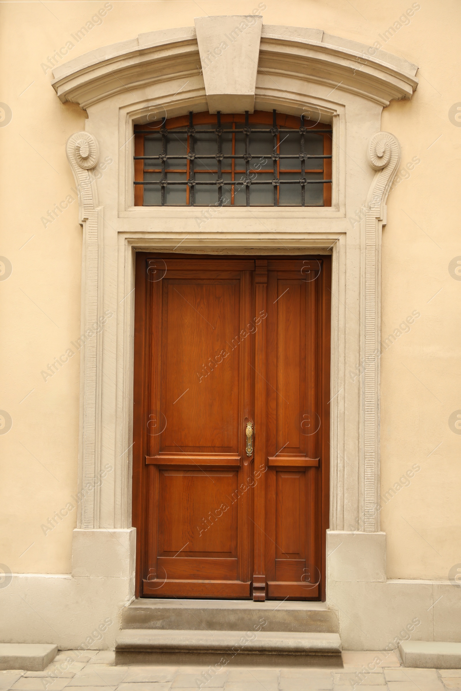 Photo of View of building with wooden door. Exterior design