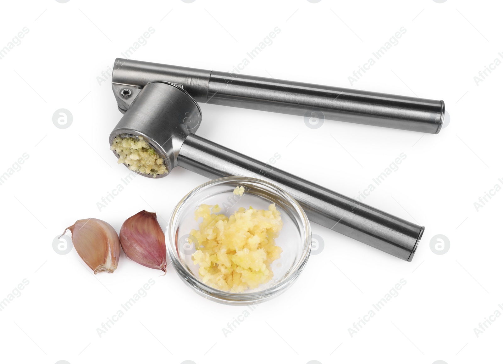 Photo of One metal press and garlic isolated on white, above view