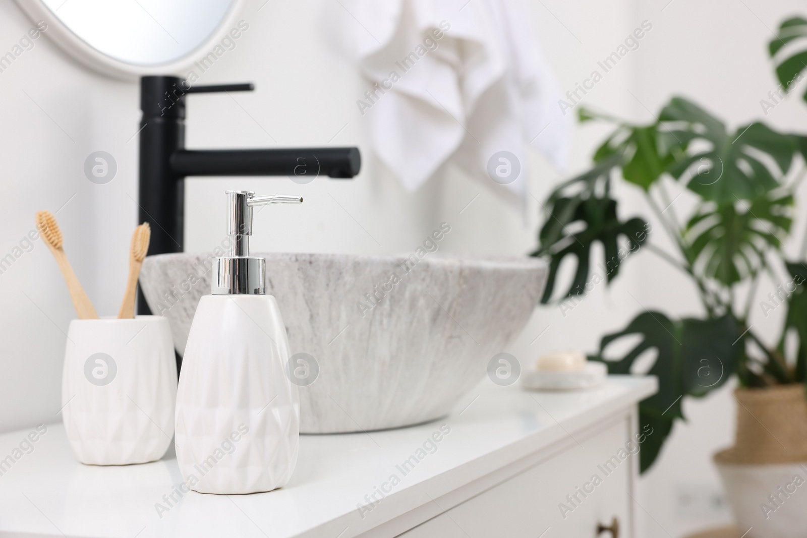 Photo of Different bath accessories and personal care products on bathroom vanity indoors, space for text