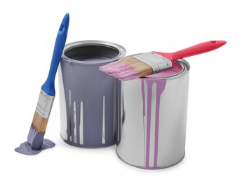 Photo of Cans with different paints and brushes on white background