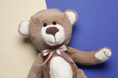 Photo of Cute teddy bear on color background, top view