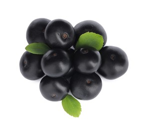 Pile of fresh ripe acai berries and green leaves on white background, top view