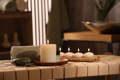 Photo of Beautiful composition with different spa products on wicker bench indoors