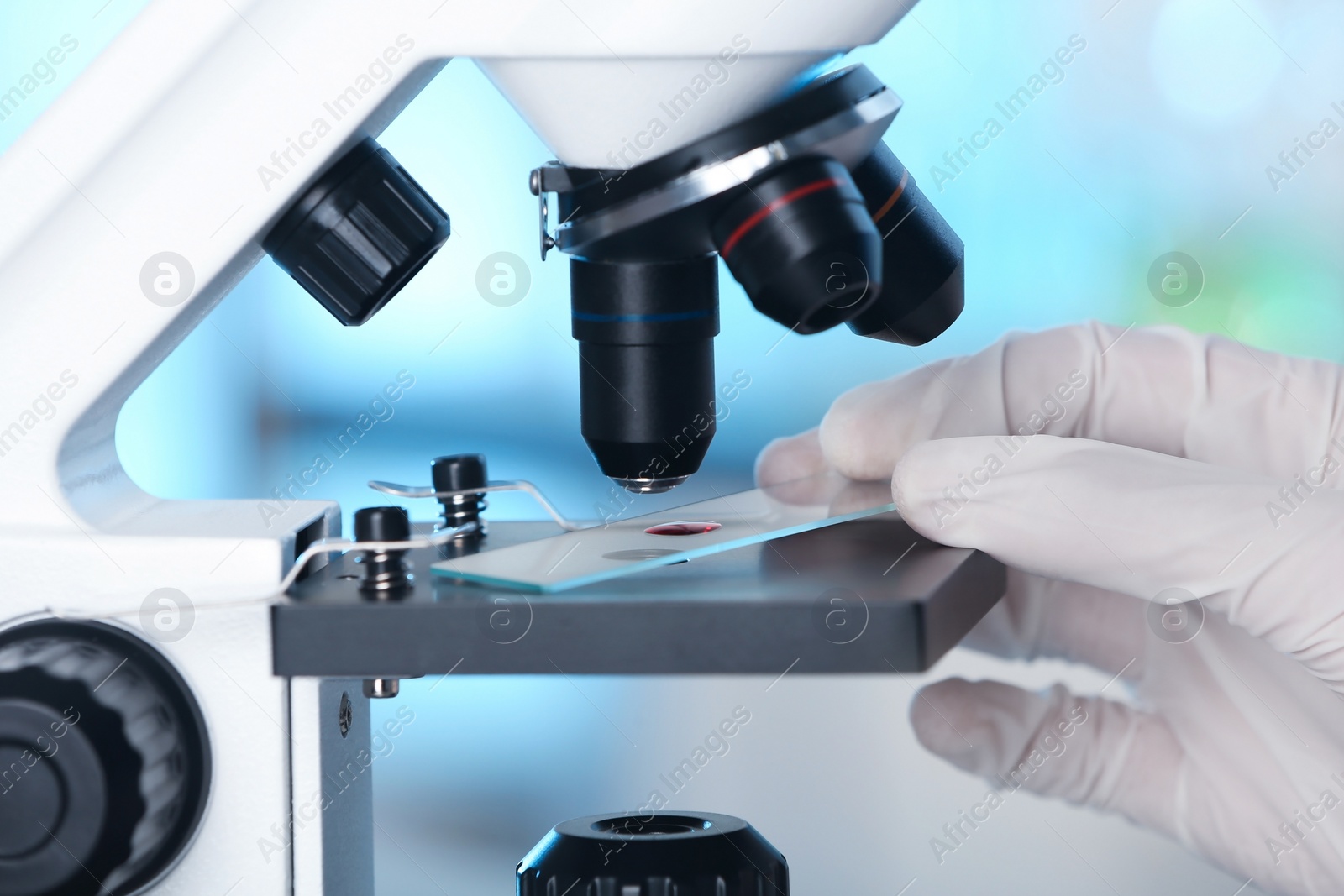 Photo of Analyst doing laboratory test with microscope, closeup. Chemical analysis