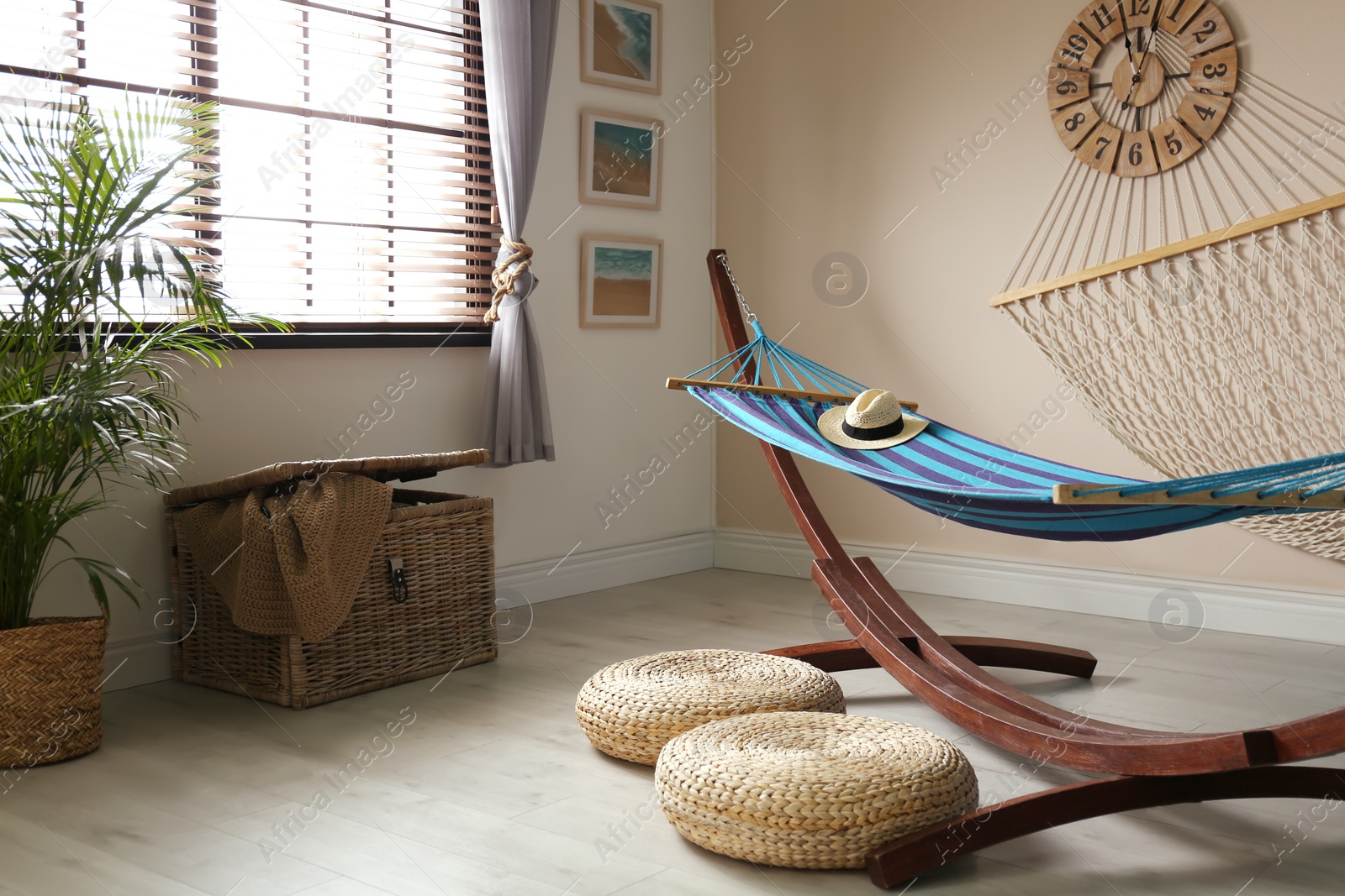 Photo of Comfortable blue hammock in stylish room. Interior design