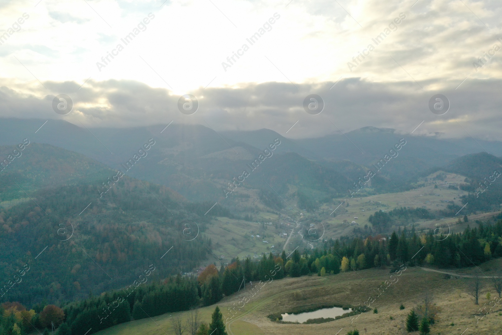 Photo of Aerial view of beautiful mountain landscape with forest at sunrise