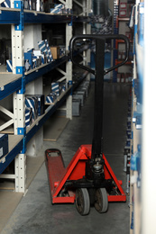 Photo of Modern wholesale shop interior with pallet jack