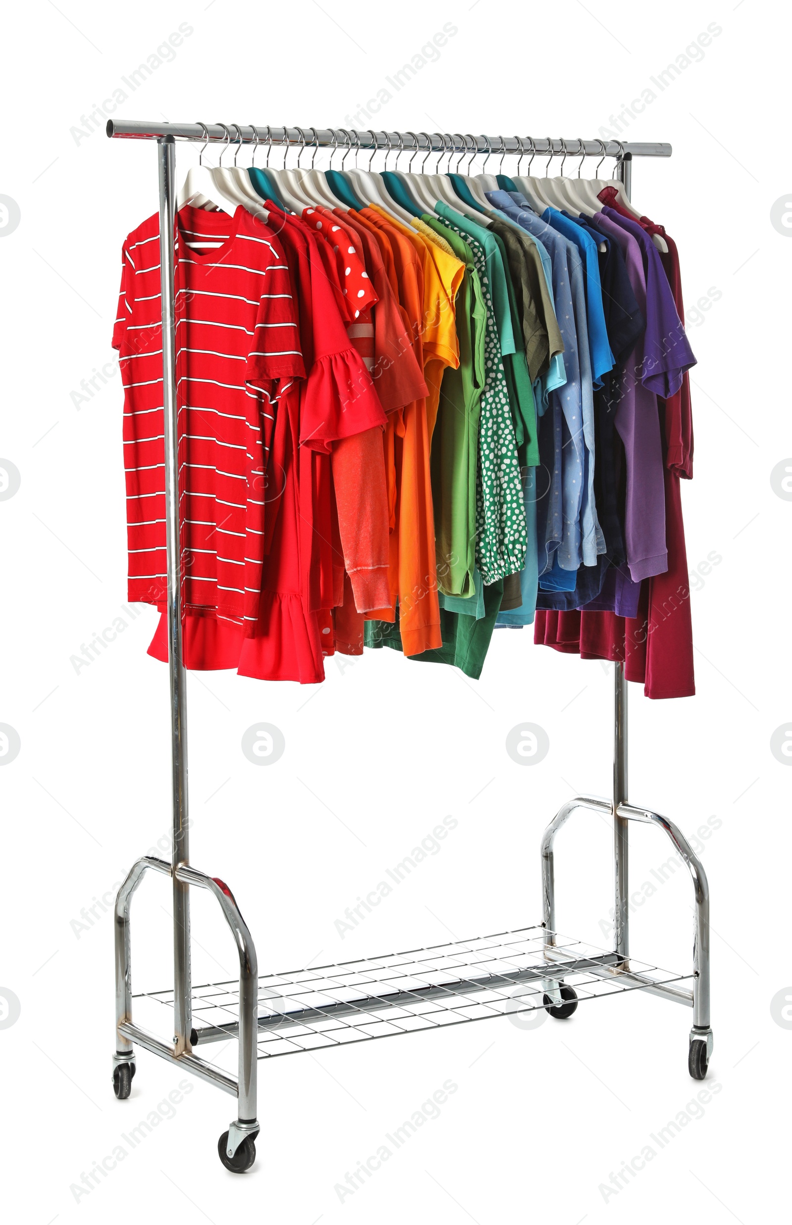 Photo of Wardrobe rack with different colorful clothes on white background