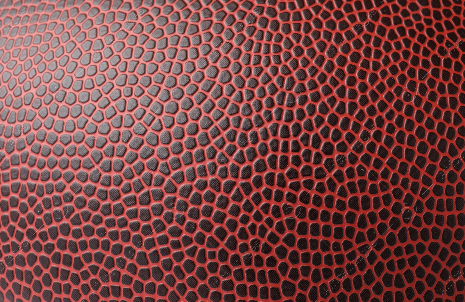 Photo of Leather American football ball as background, closeup