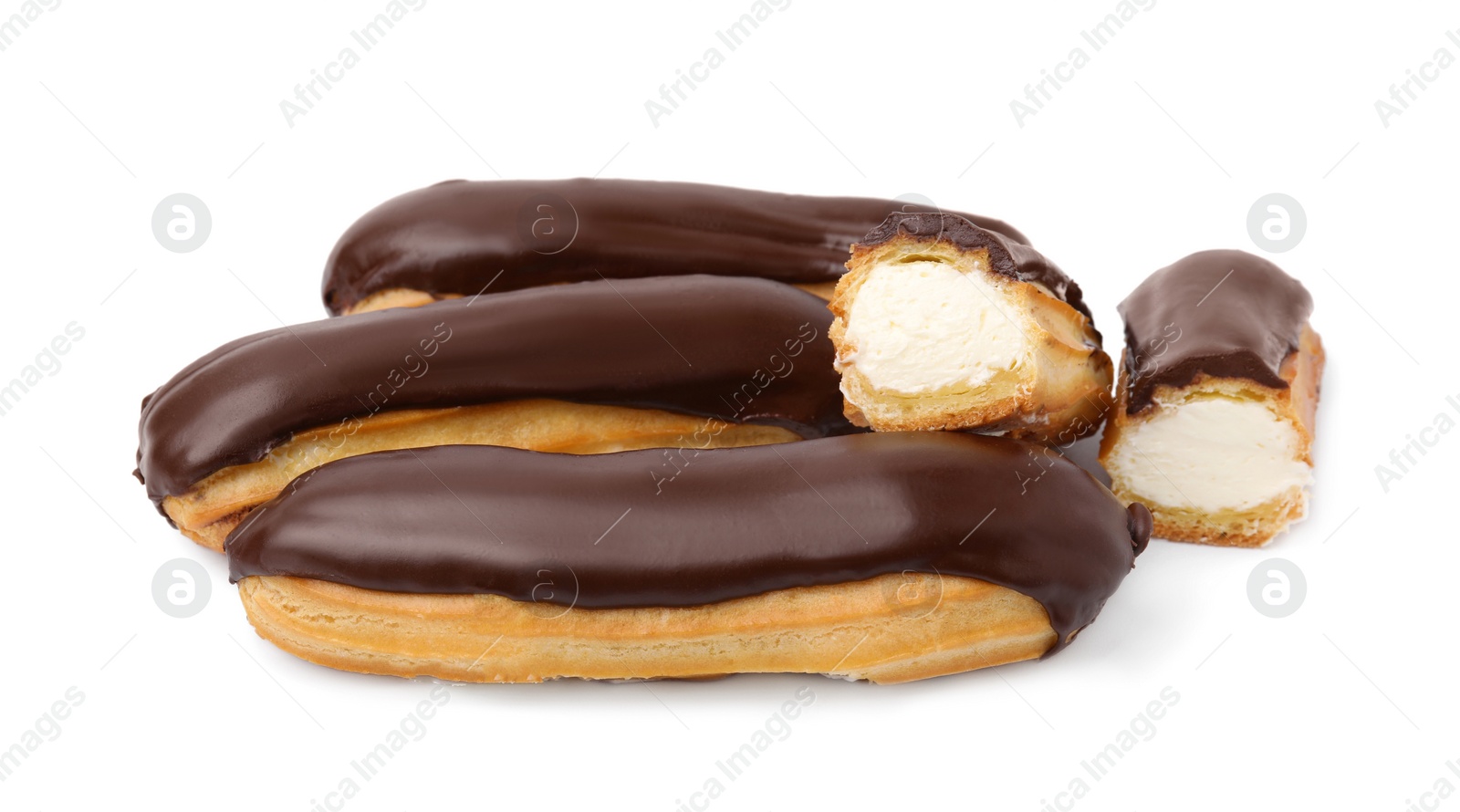 Photo of Delicious eclairs covered with chocolate isolated on white