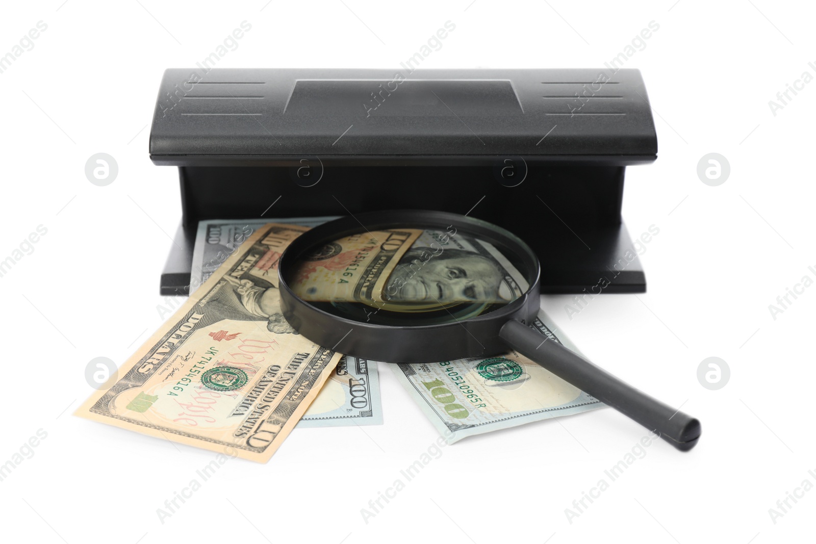 Photo of Modern currency detector with dollar banknotes and magnifying glass on white background. Money examination device