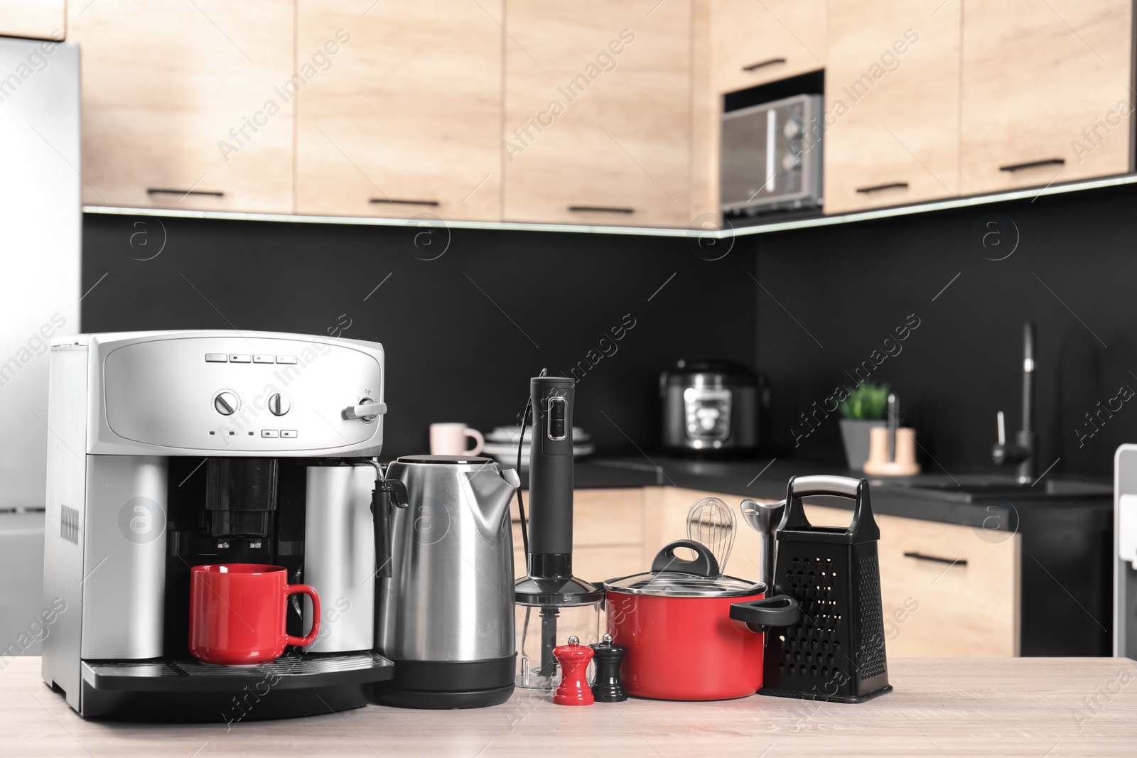 Photo of Set with modern domestic appliances in kitchen