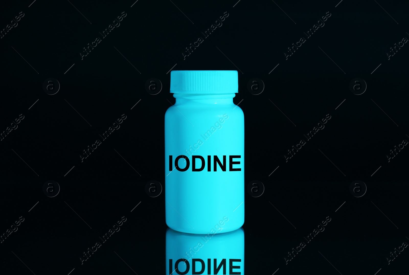 Photo of Plastic container of medical iodine on black background, color tone effect