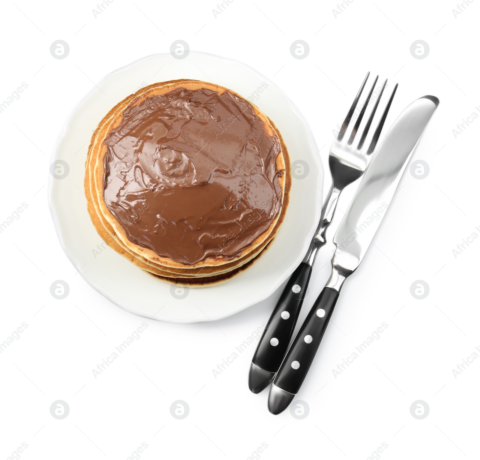 Photo of Tasty pancakes with chocolate paste and cutlery isolated on white, top view