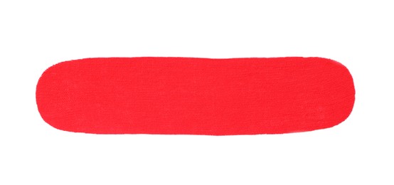 Photo of Red kinesio tape piece on white background, top view