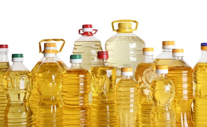 Photo of Bottles of cooking oil on white background