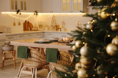 Photo of Cozy kitchen decorated for Christmas dinner. Interior design