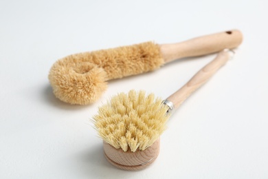 Cleaning brushes for dish washing on white background, closeup