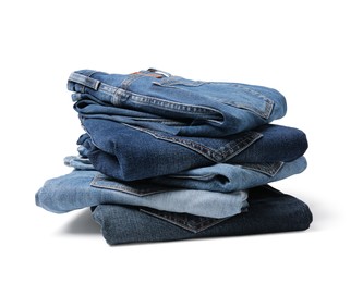 Stack of different folded jeans isolated on white