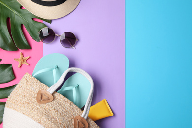 Flat lay composition with beach objects on color background. Space for text