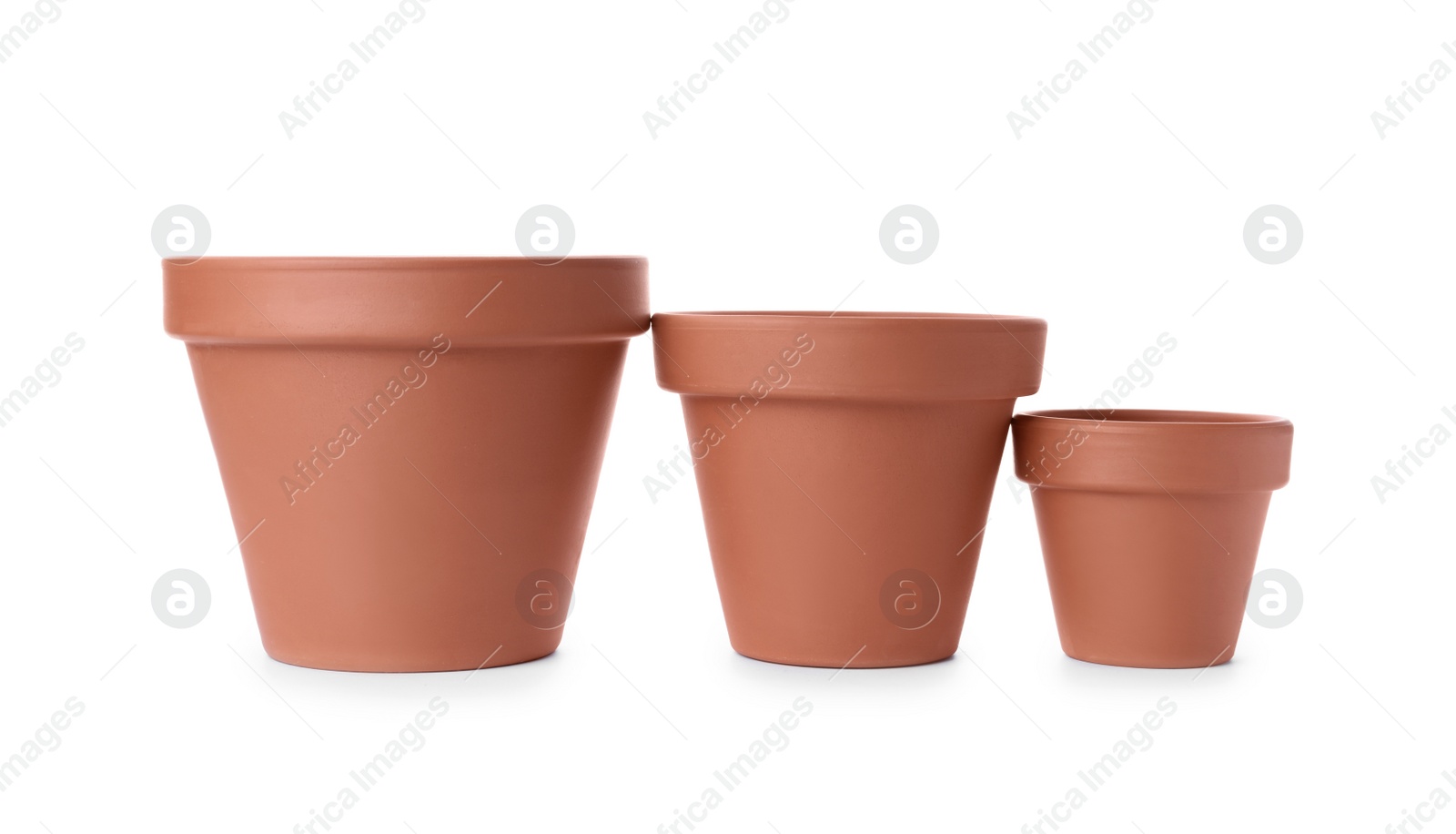 Photo of Stylish terracotta flower pots isolated on white