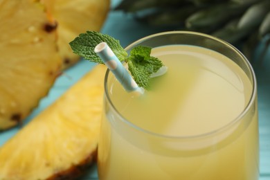 Delicious fresh pineapple juice with mint, closeup