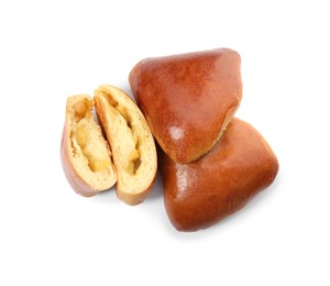 Photo of Delicious baked apple pirozhki on white background, top view