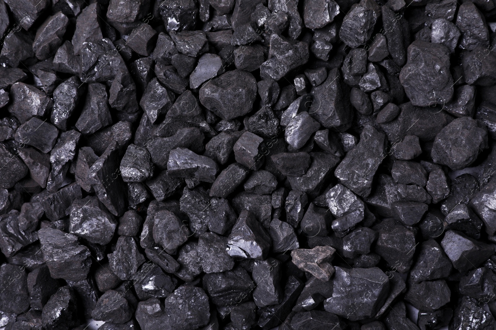 Photo of Pieces of black coal as background, top view