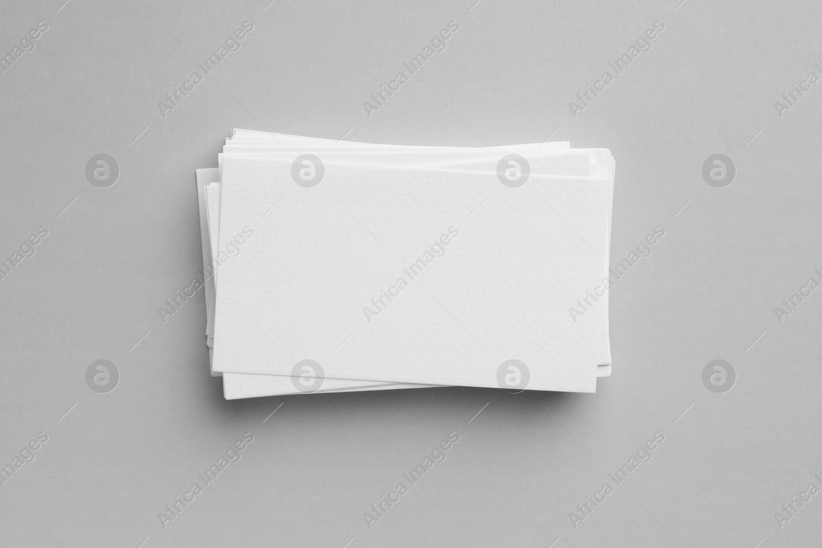 Photo of Blank business cards on light gray background, top view. Mockup for design