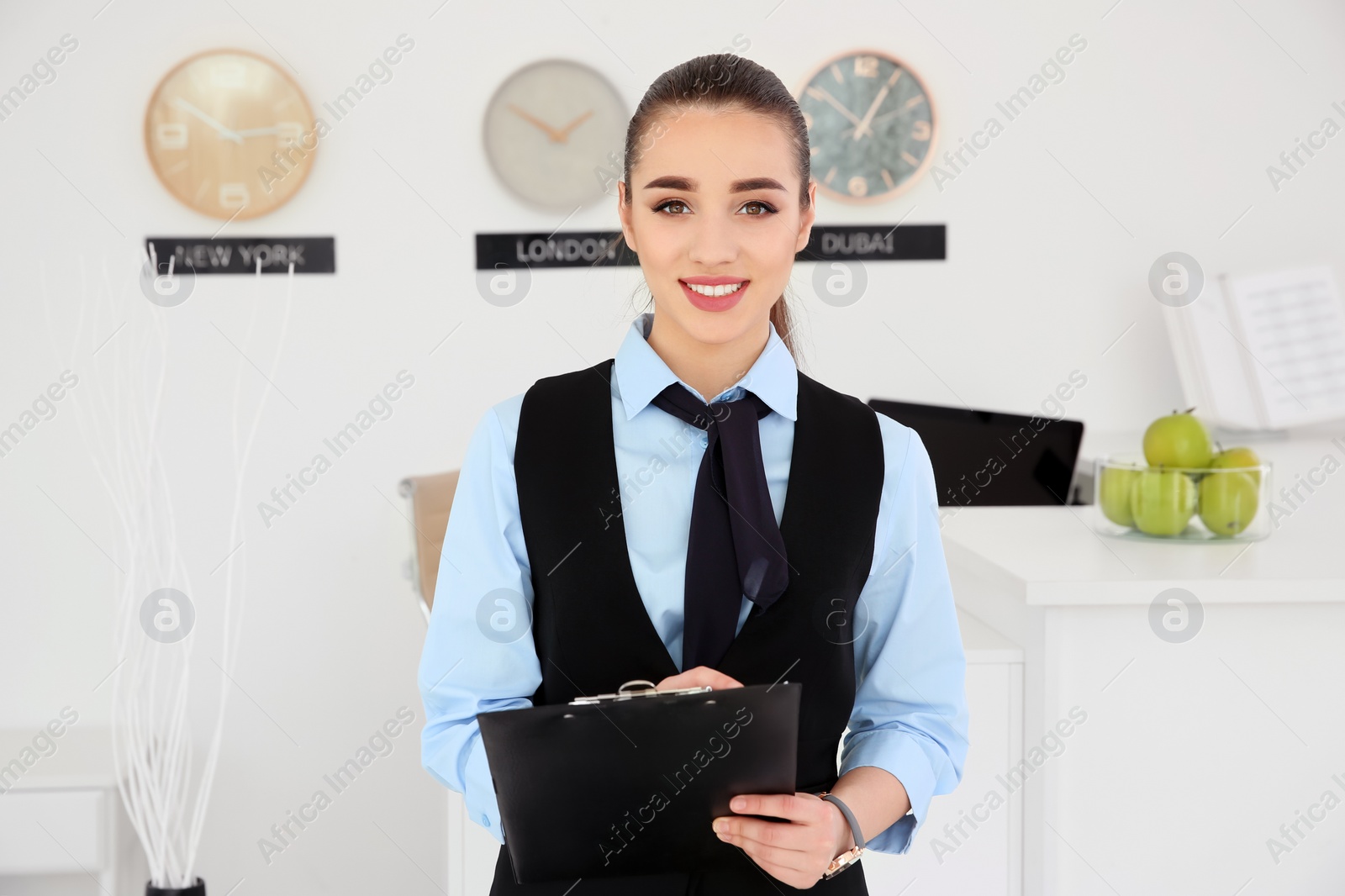 Photo of Portrait of female receptionist at workplace in hotel