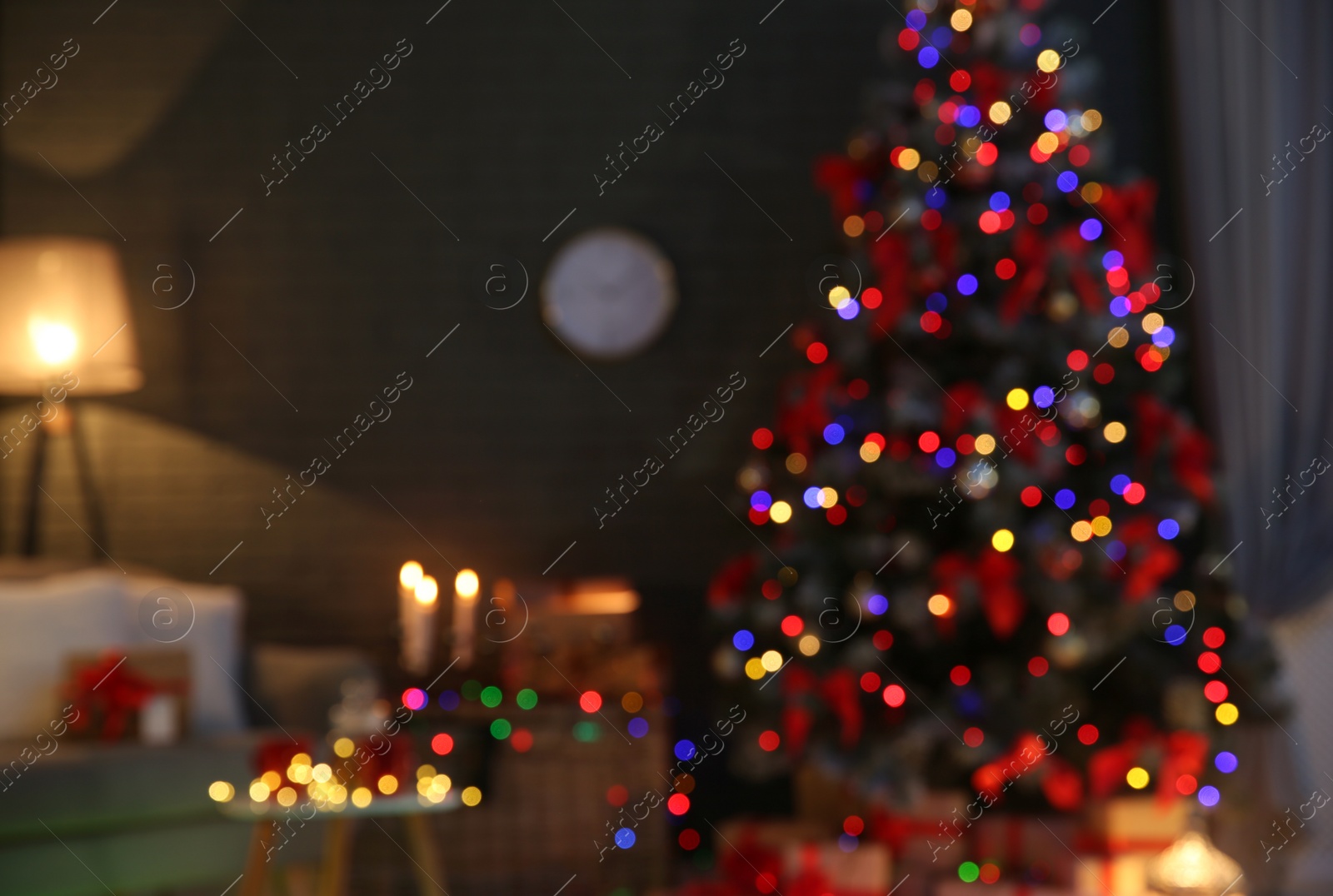 Photo of Blurred view of stylish room interior with decorated Christmas tree