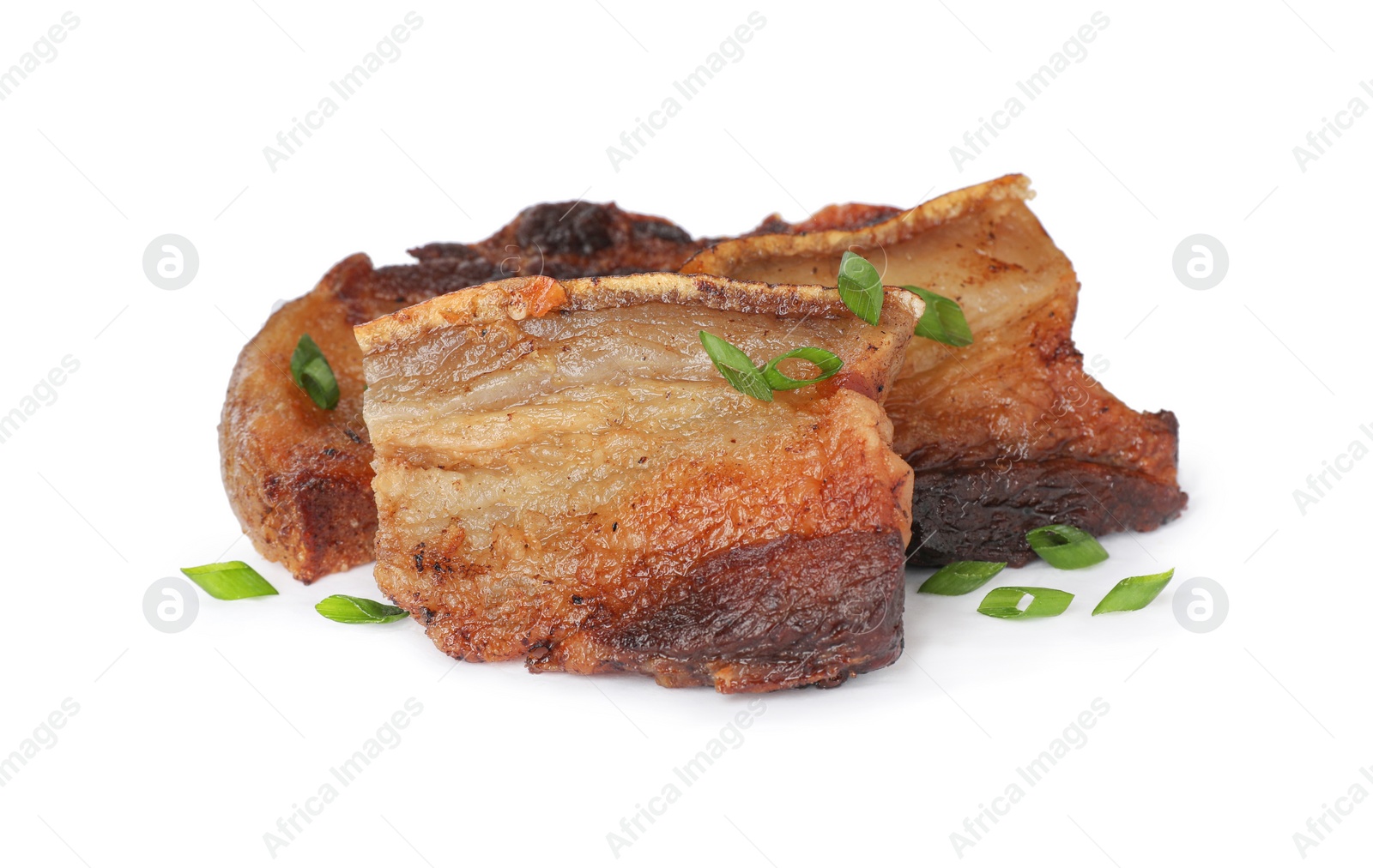 Photo of Tasty fried cracklings with parsley on white background. Cooked pork lard