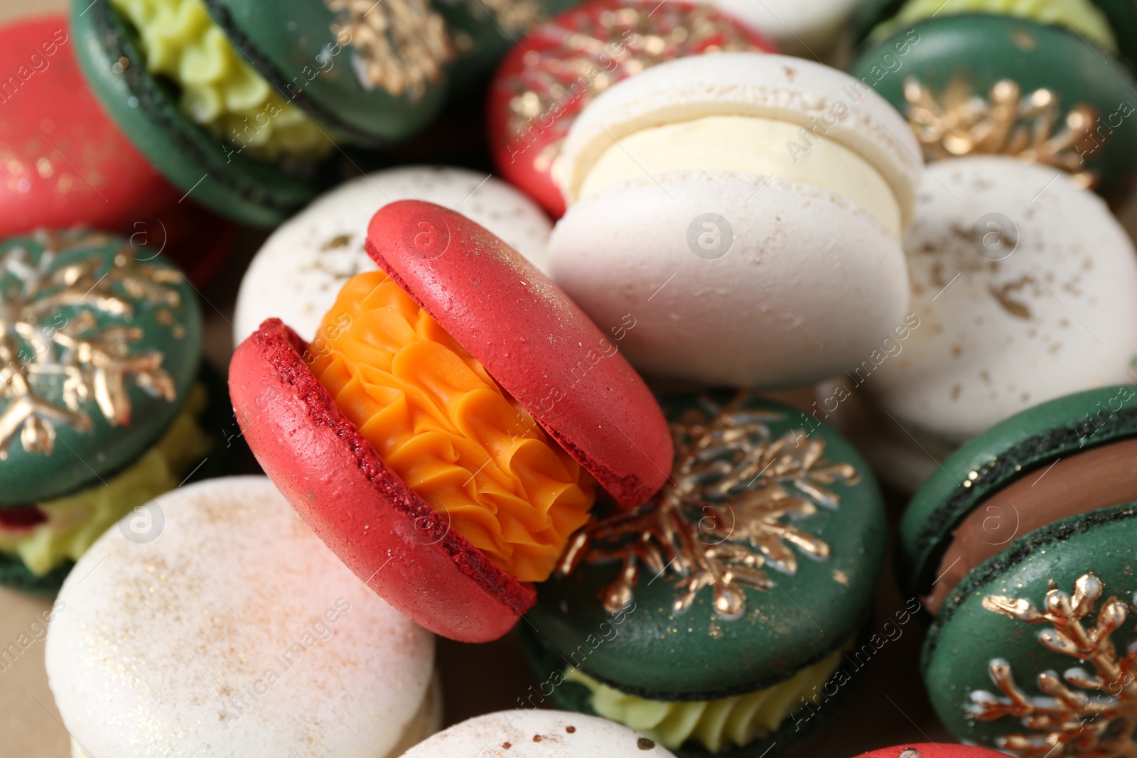 Photo of Beautifully decorated Christmas macarons as background, closeup