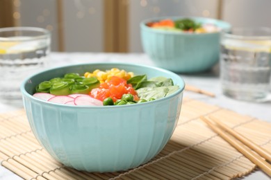 Delicious salad with salmon and vegetables served on table