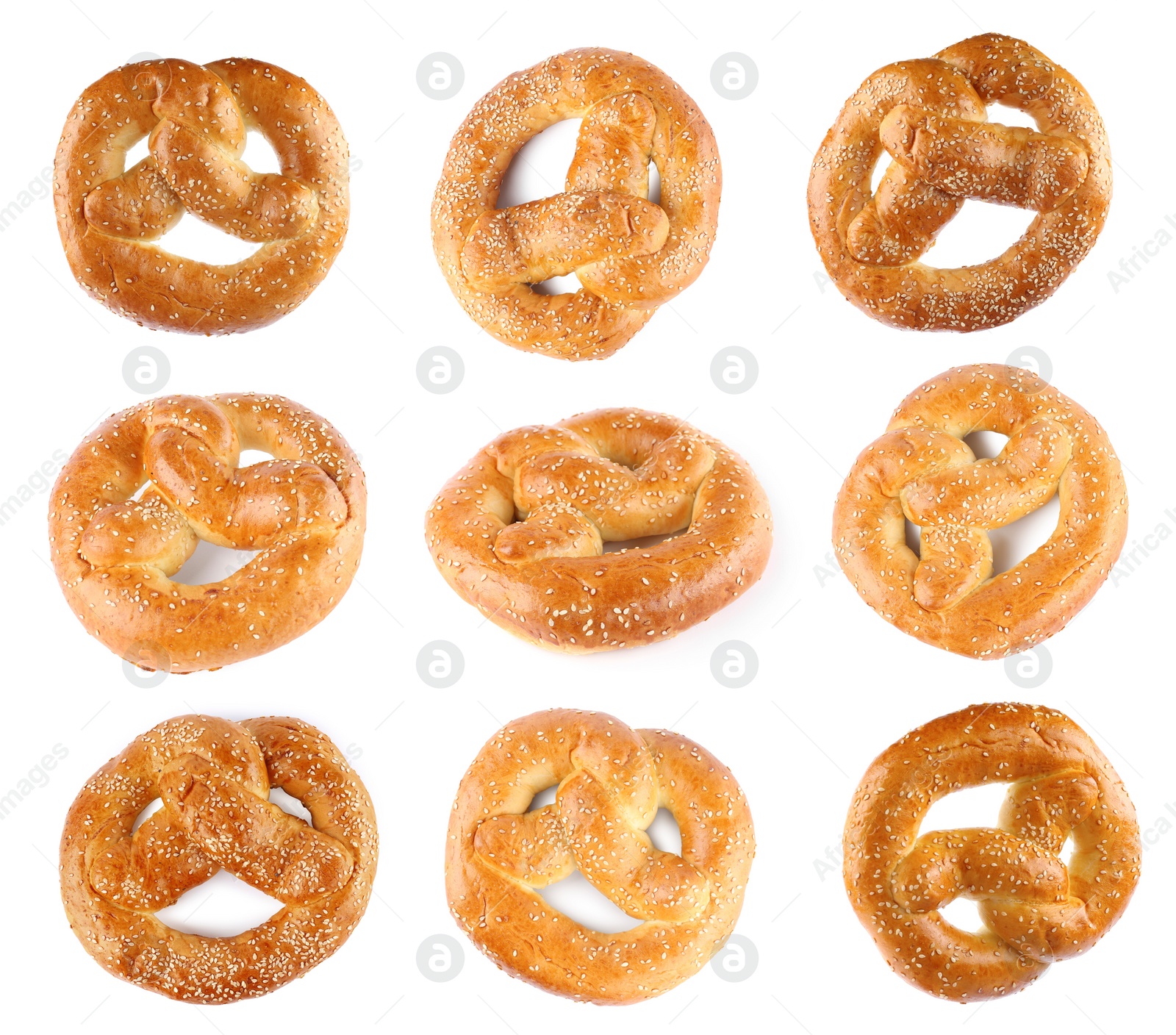 Image of Set with tasty freshly baked pretzels on white background