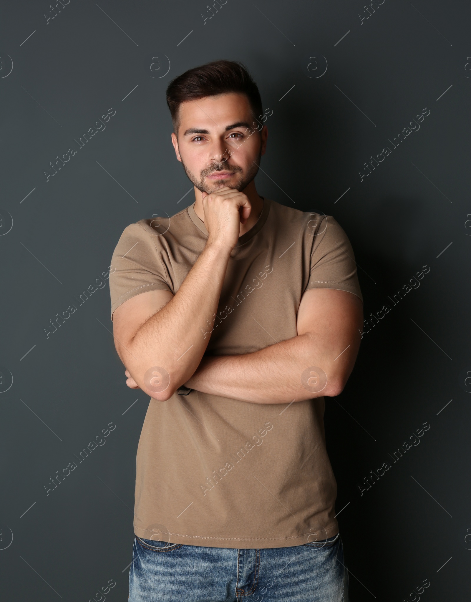 Photo of Portrait of handsome man on dark background