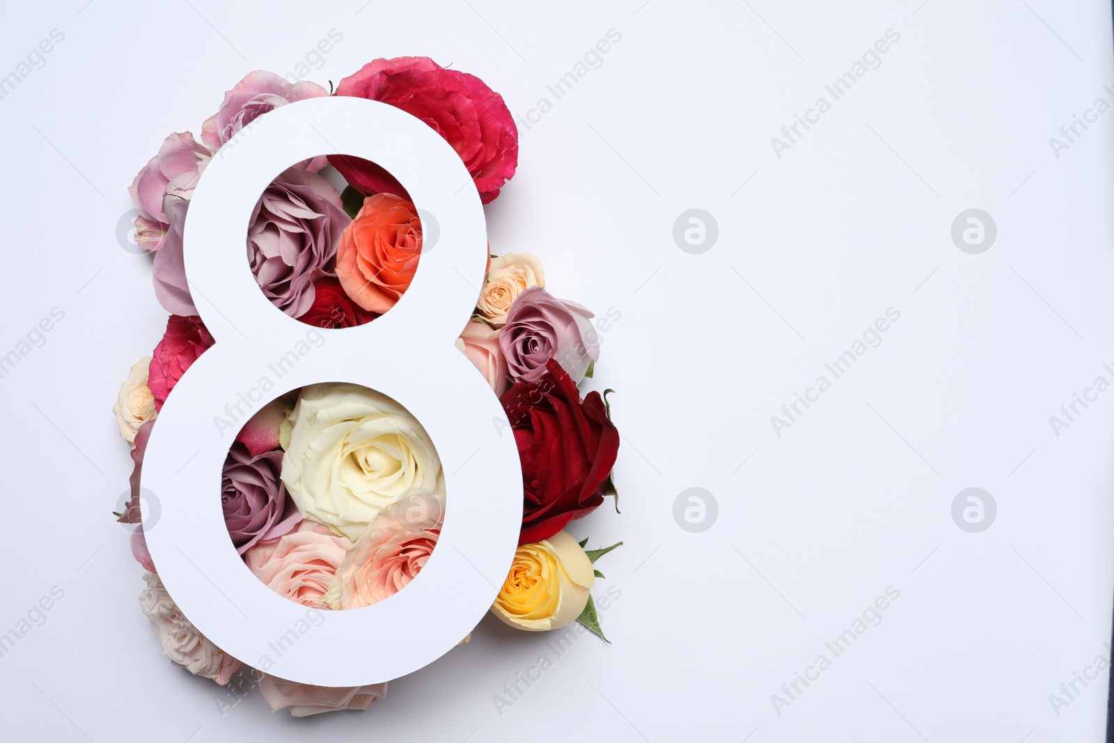 Photo of 8 March greeting card design with roses on white background, top view. Happy International Women's Day