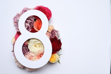 8 March greeting card design with roses on white background, top view. Happy International Women's Day