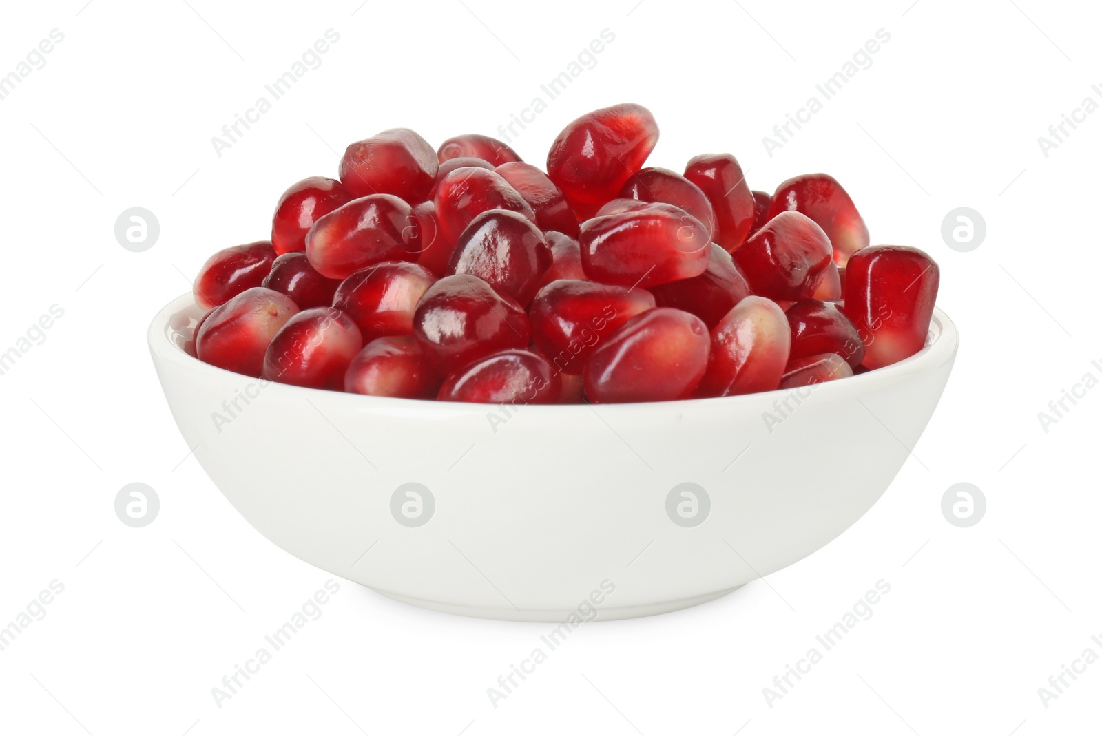 Photo of Ripe juicy pomegranate grains in bowl isolated on white