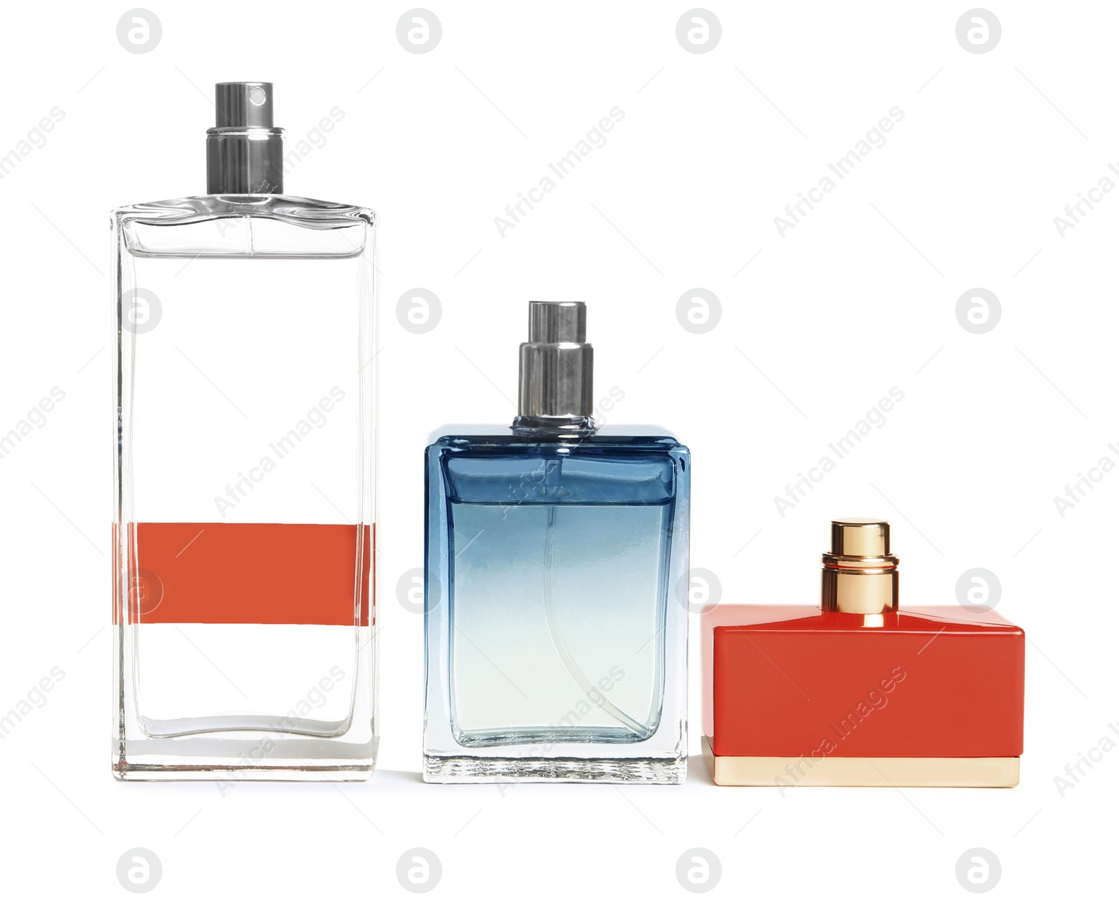 Photo of Different perfume bottles on white background