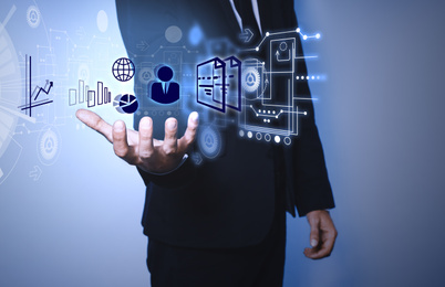 Image of  Man demonstrating icons of data management system on light background, closeup