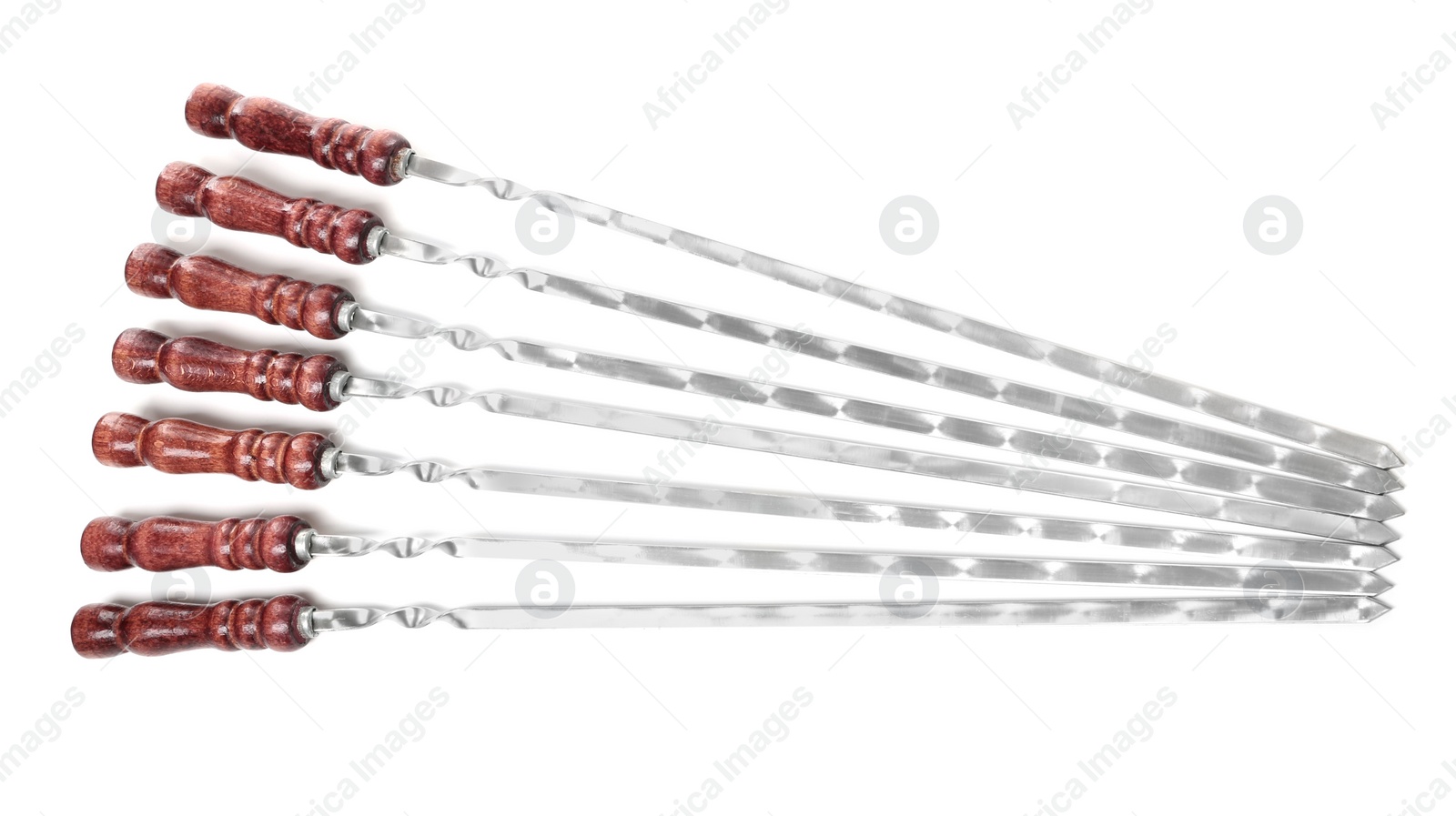 Photo of Metal skewers with wooden handle on white background, top view