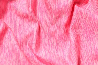 Photo of Texture of soft pink fabric as background, top view