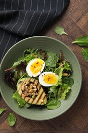 Healthy dish high in vegetable fats on wooden table, top view