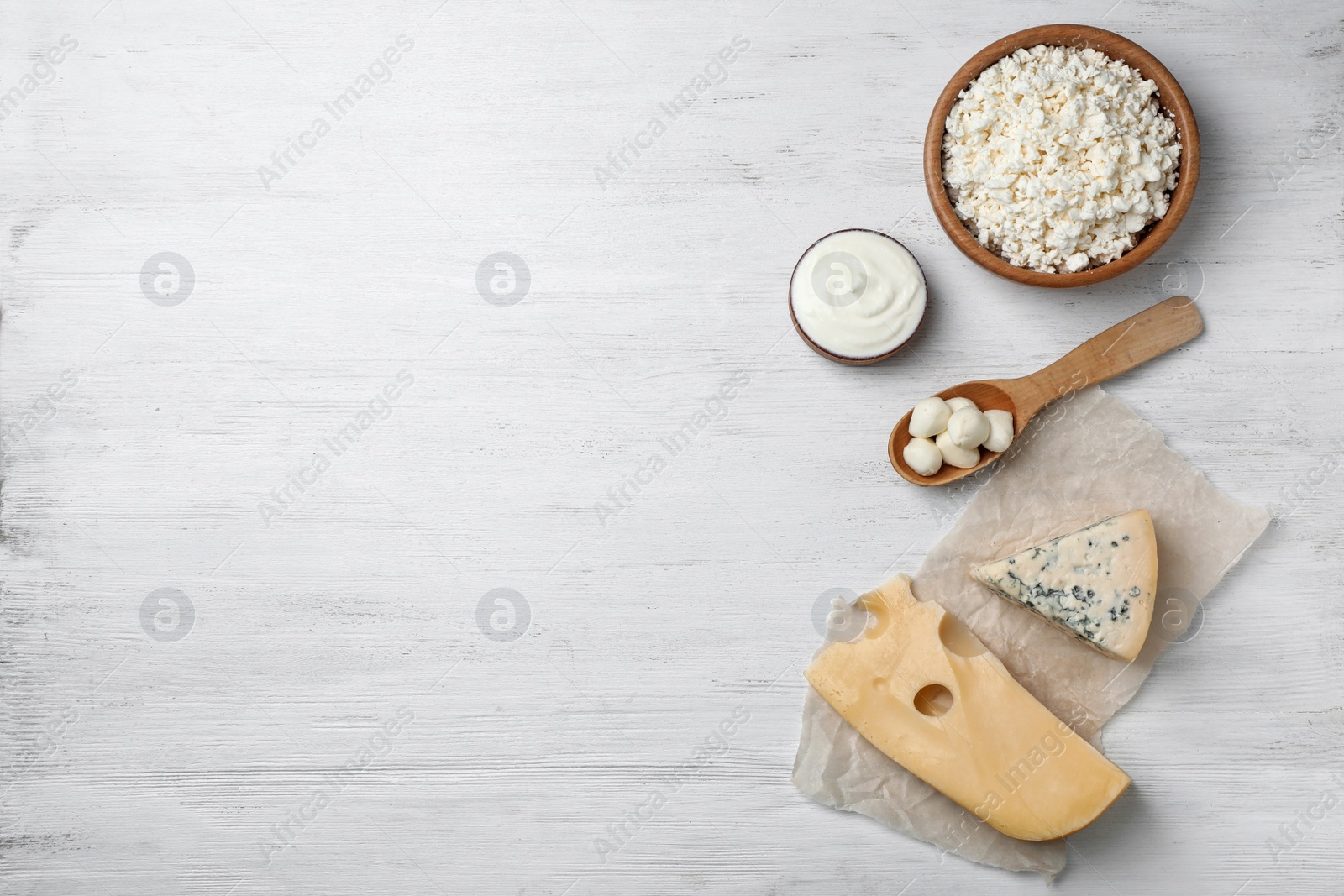 Photo of Different dairy products on wooden background