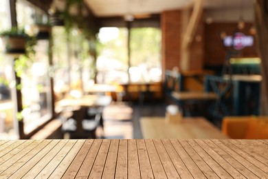 Image of Empty wooden surface in cafe. Space for design